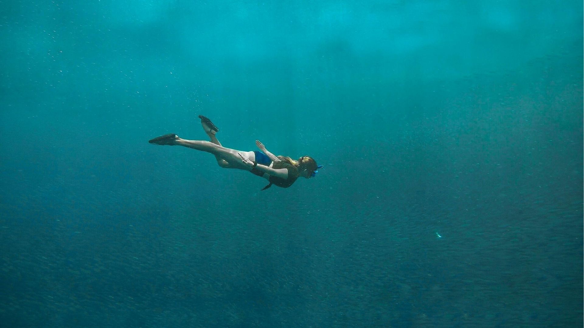 Snorkeller in clear blue water
